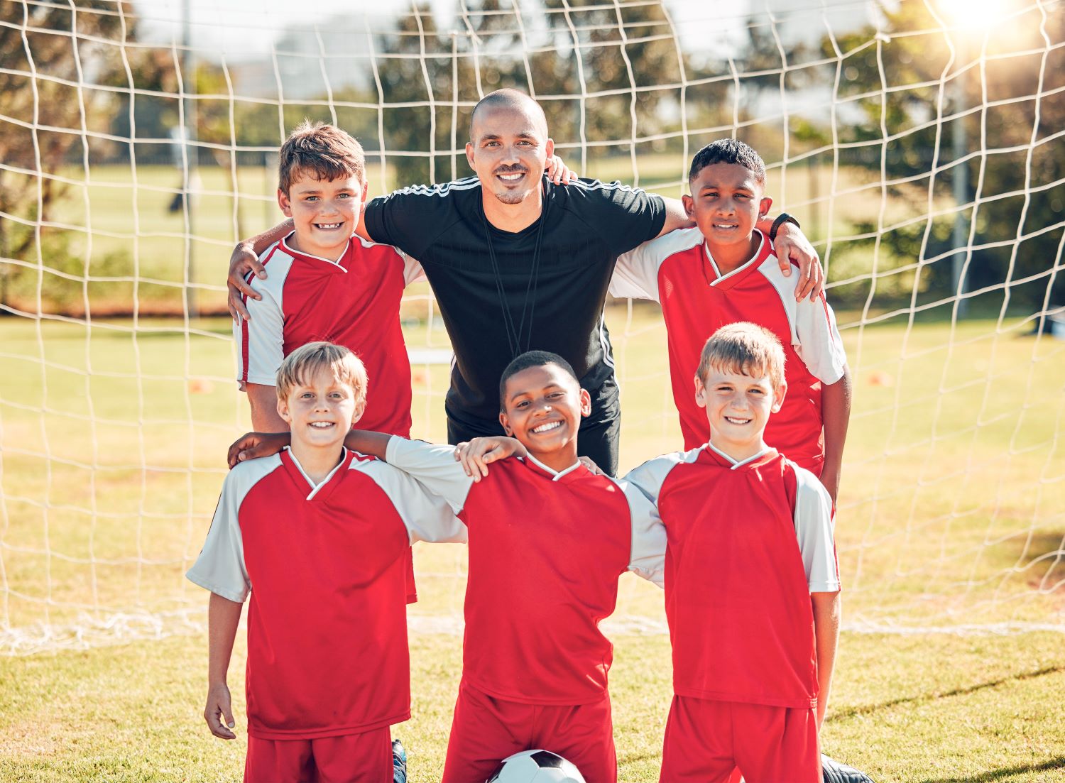 Coach with young players